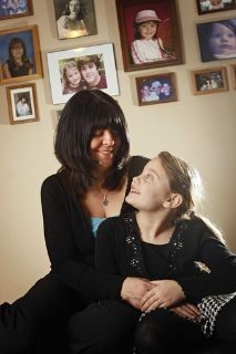 Dena Lockwood, with her daughter Lily Lockwood, 7, at home.